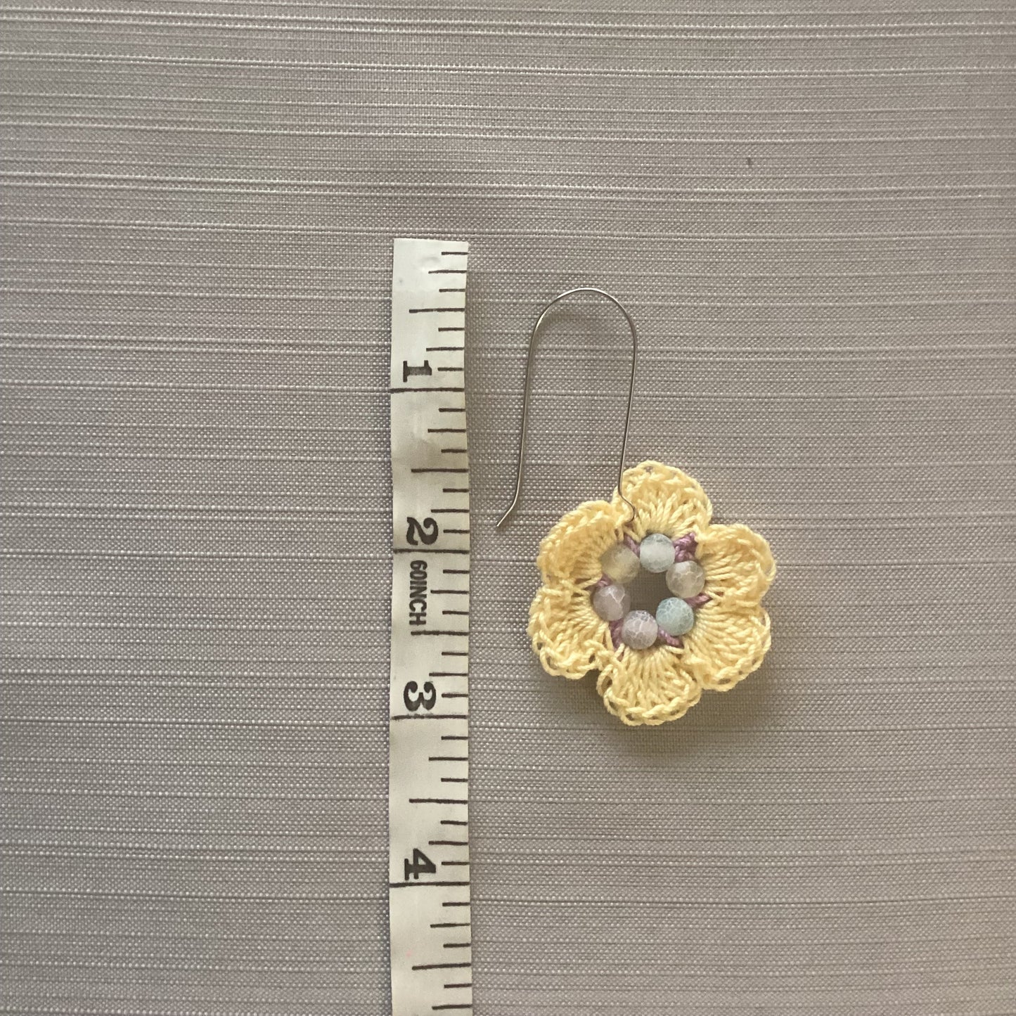 Crocheted flower earrings made with cotton thread and agate, beads, yellow, and purple