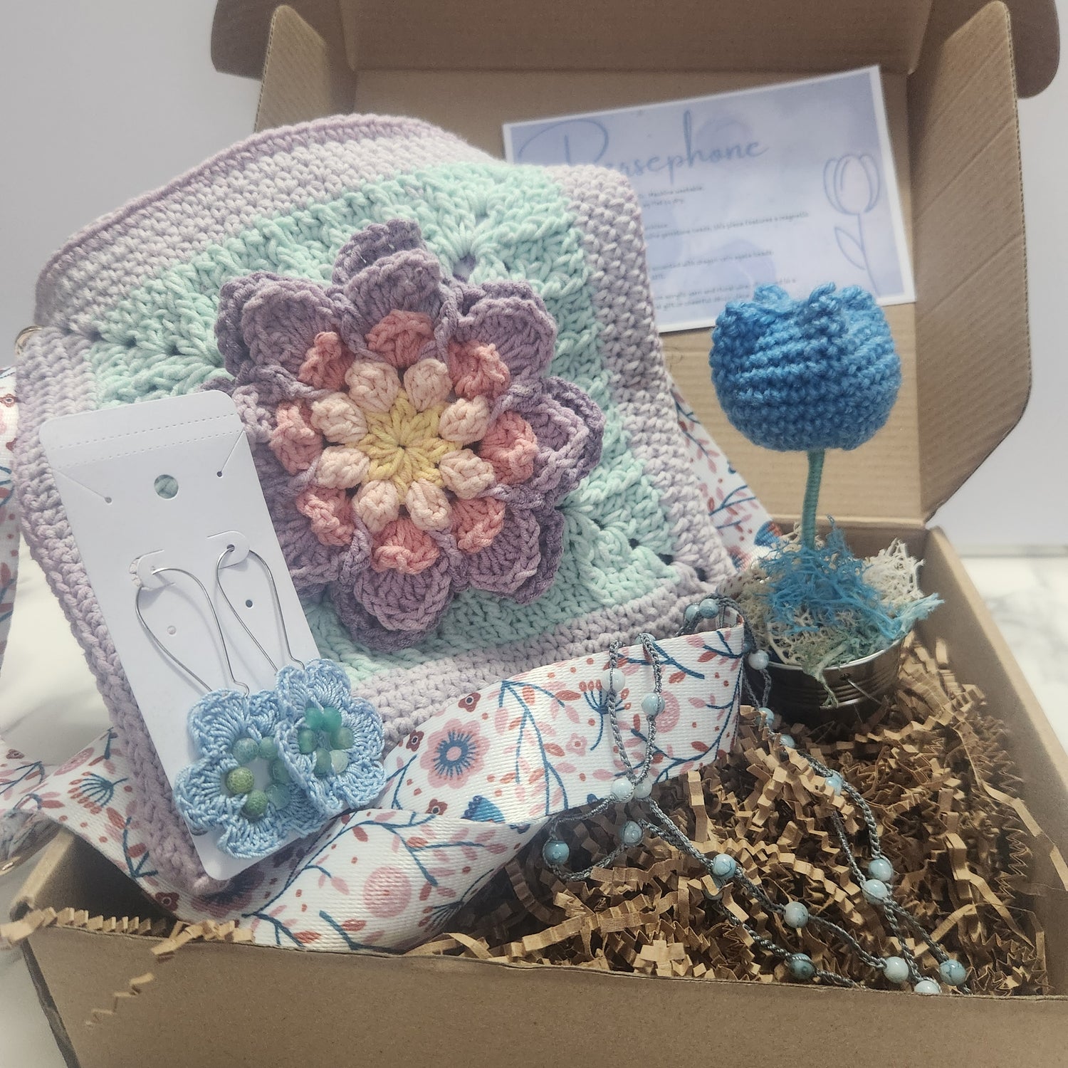 Persephone gift box includes lotus kiss purse, floral earrings, versatile bracelet and crochet tulips purple and blue theme