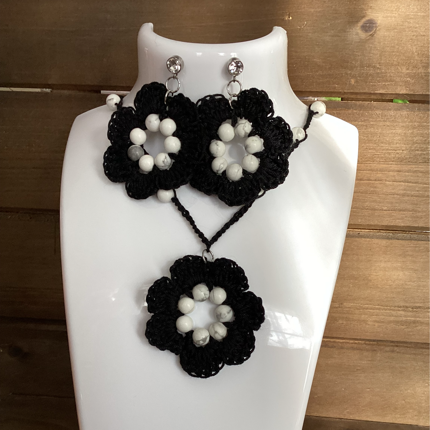 black flower necklace and earring set, made with white howlite beads, flower necklace has a magnetic heart clasp, earring have a rhinestone stud