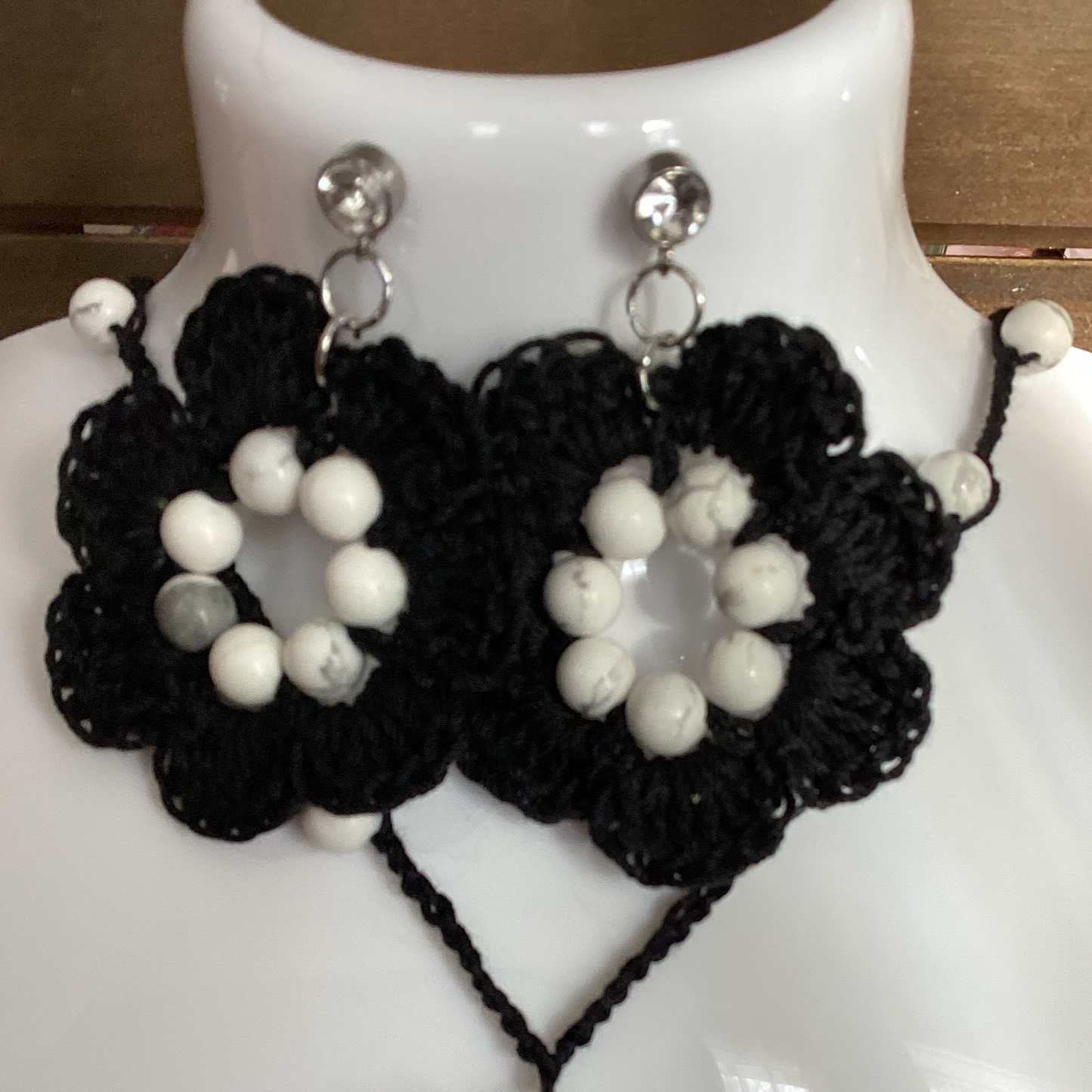 black flower necklace and earring set, made with white howlite beads, flower necklace has a magnetic heart clasp, earring have a rhinestone stud