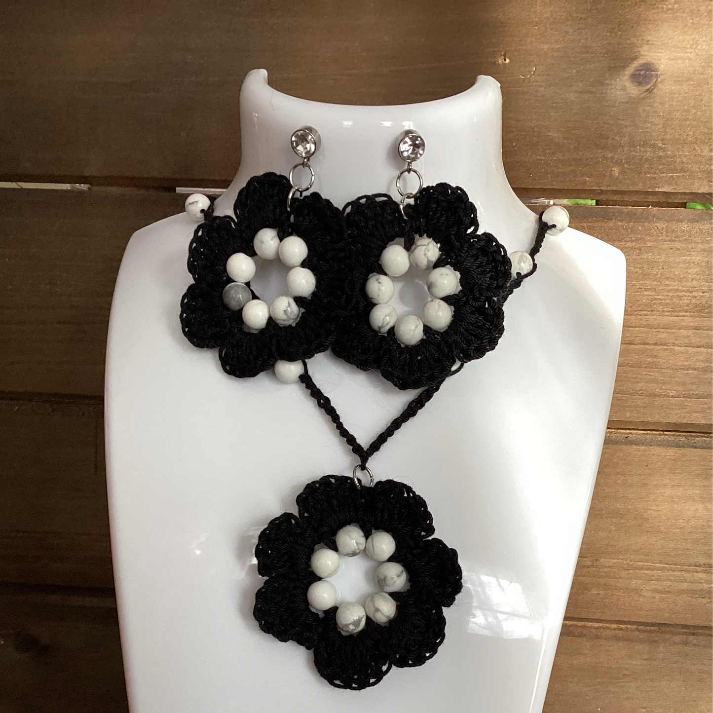 black flower necklace and earring set, made with white howlite beads, flower necklace has a magnetic heart clasp, earring have a rhinestone stud