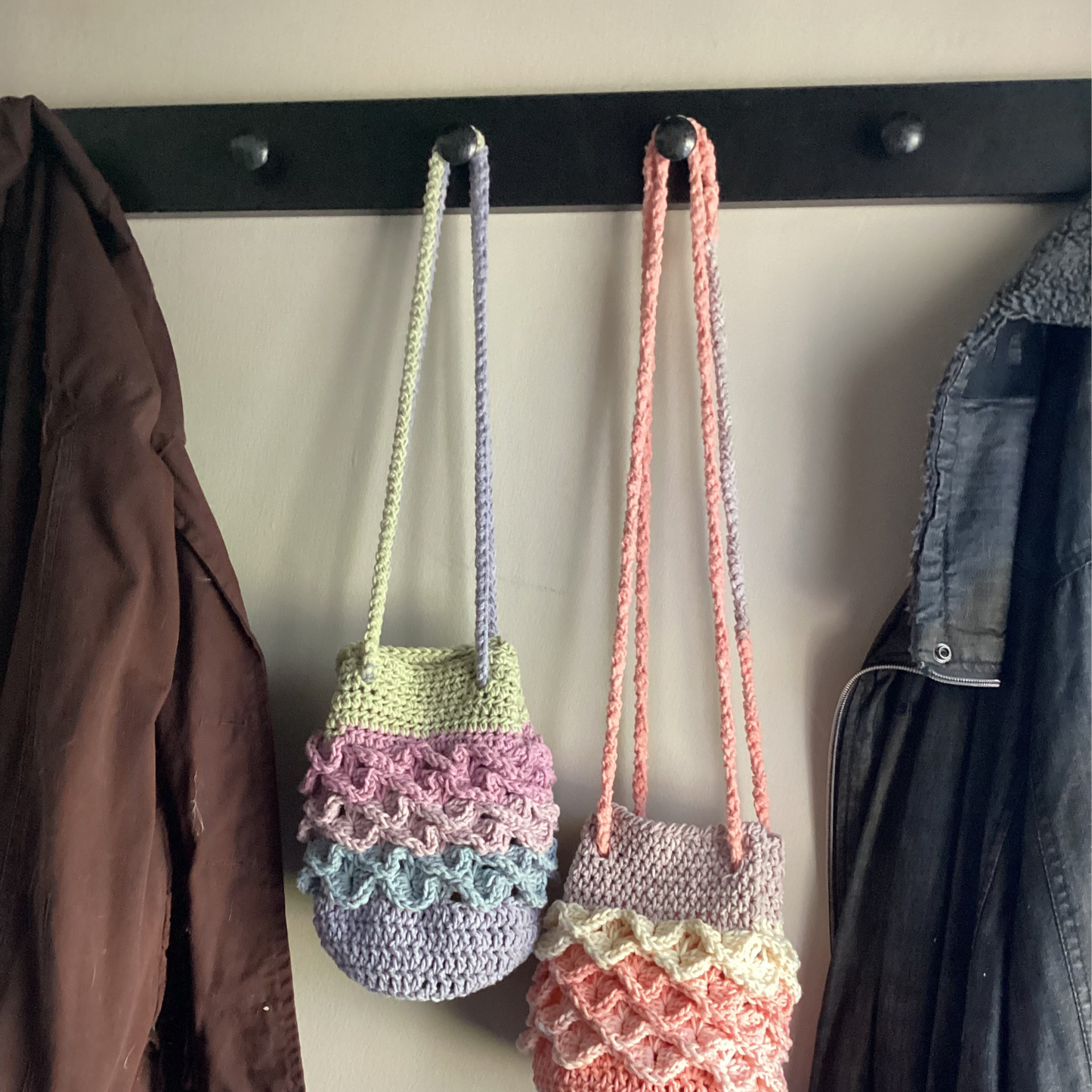 mermaid purses hanging on hooks vibrant colors