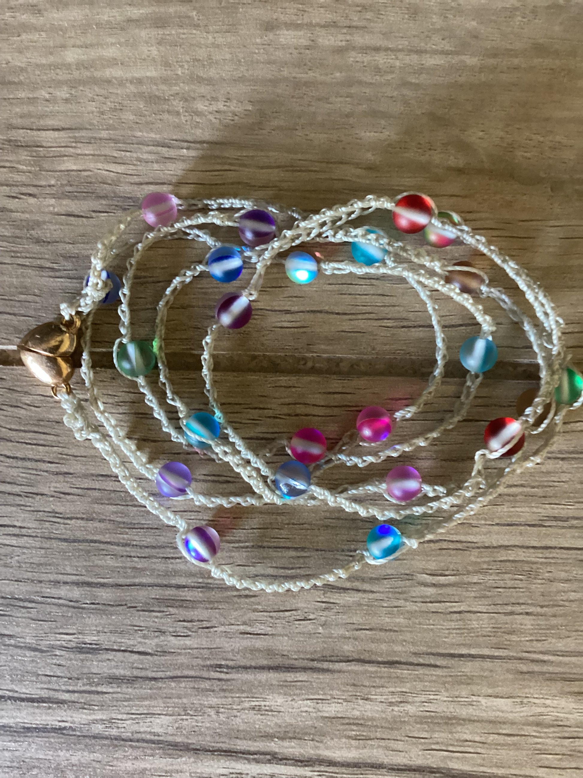 Crocheted necklace wrap/bracelet made with frosted multicoloured beads