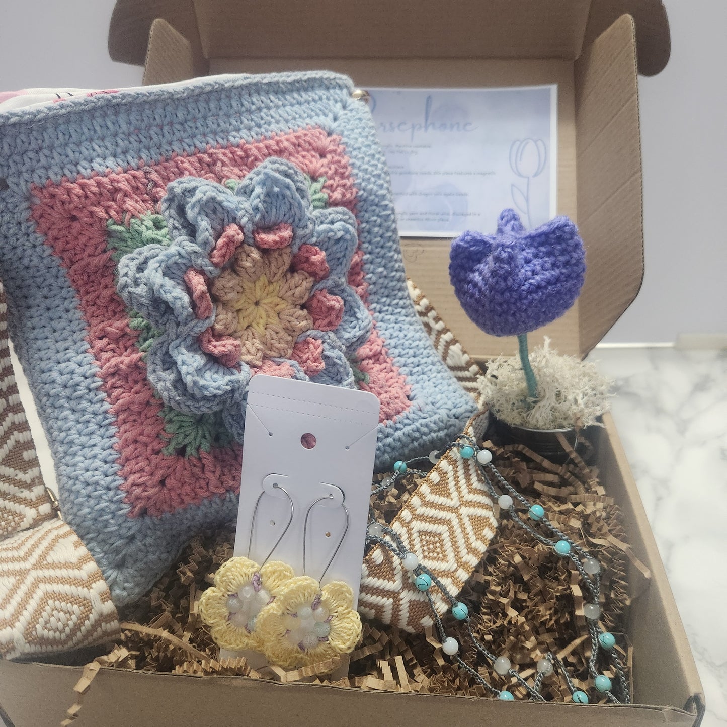 Persephone gift box includes lotus kiss purse, floral earrings, versatile bracelet and crochet tulips  blue theme