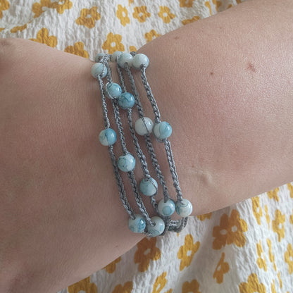 The versatile bracelet!  blue beads with silver s-lon cord
