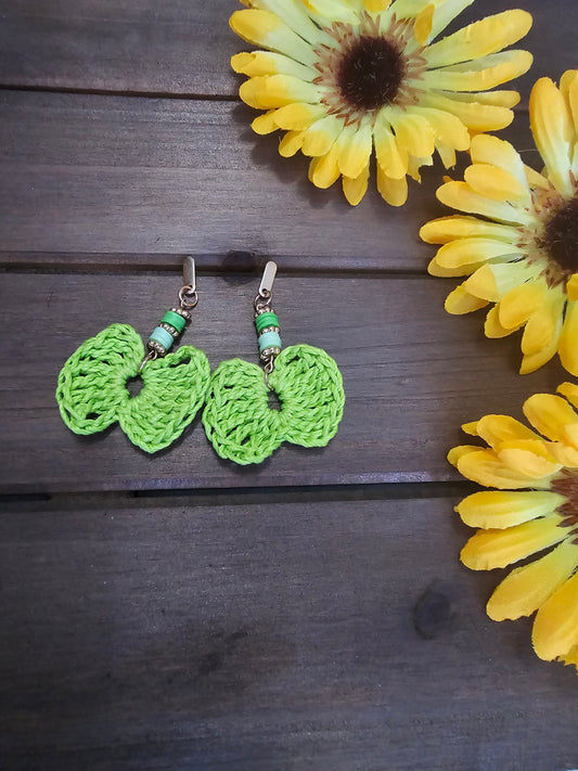 beaded bow earrings green made with green clay beads and gold earring findings  and a bamboo crocheted bow 