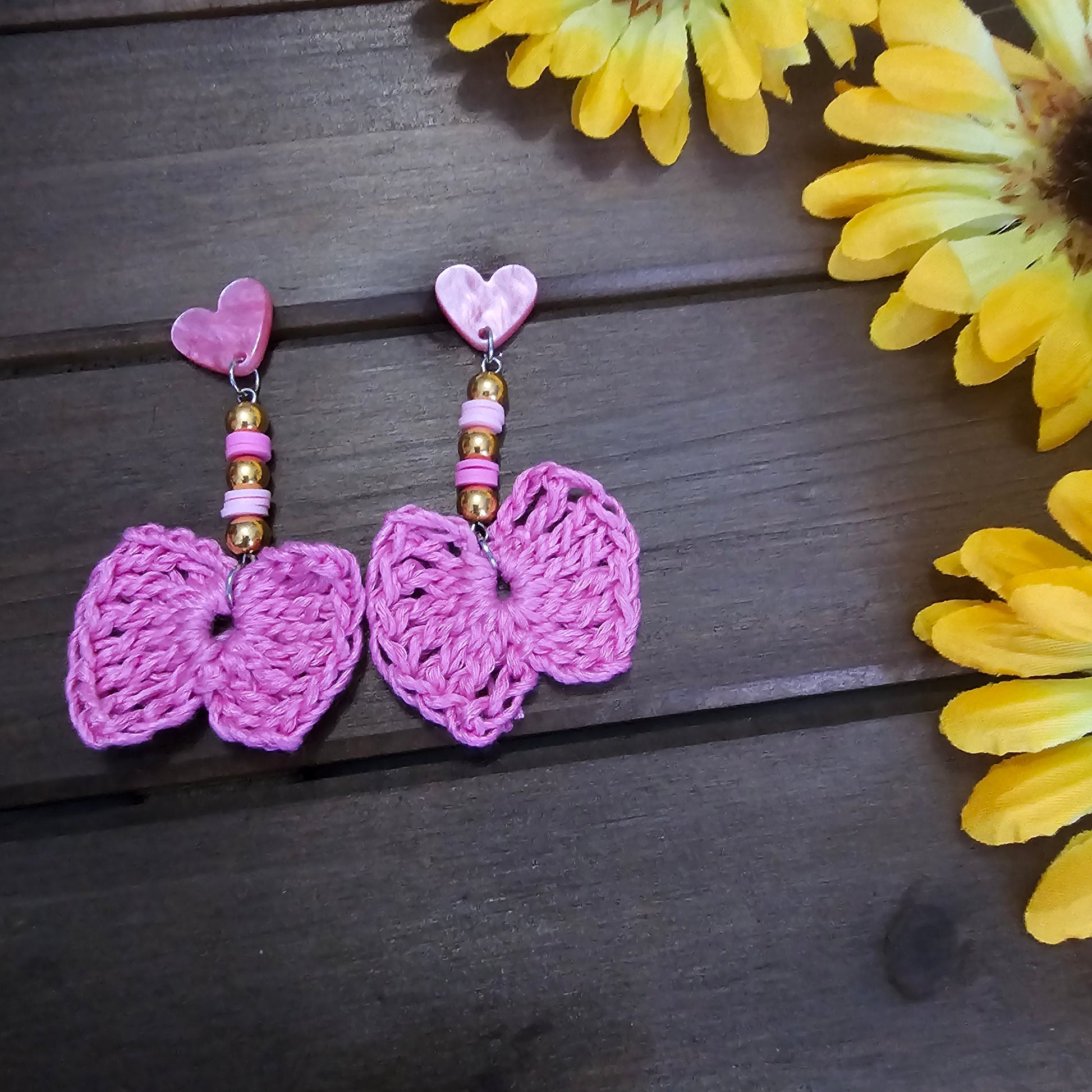 beaded bow earrings green made with green clay beads and pink heart earring findings  and a bamboo crocheted bow 