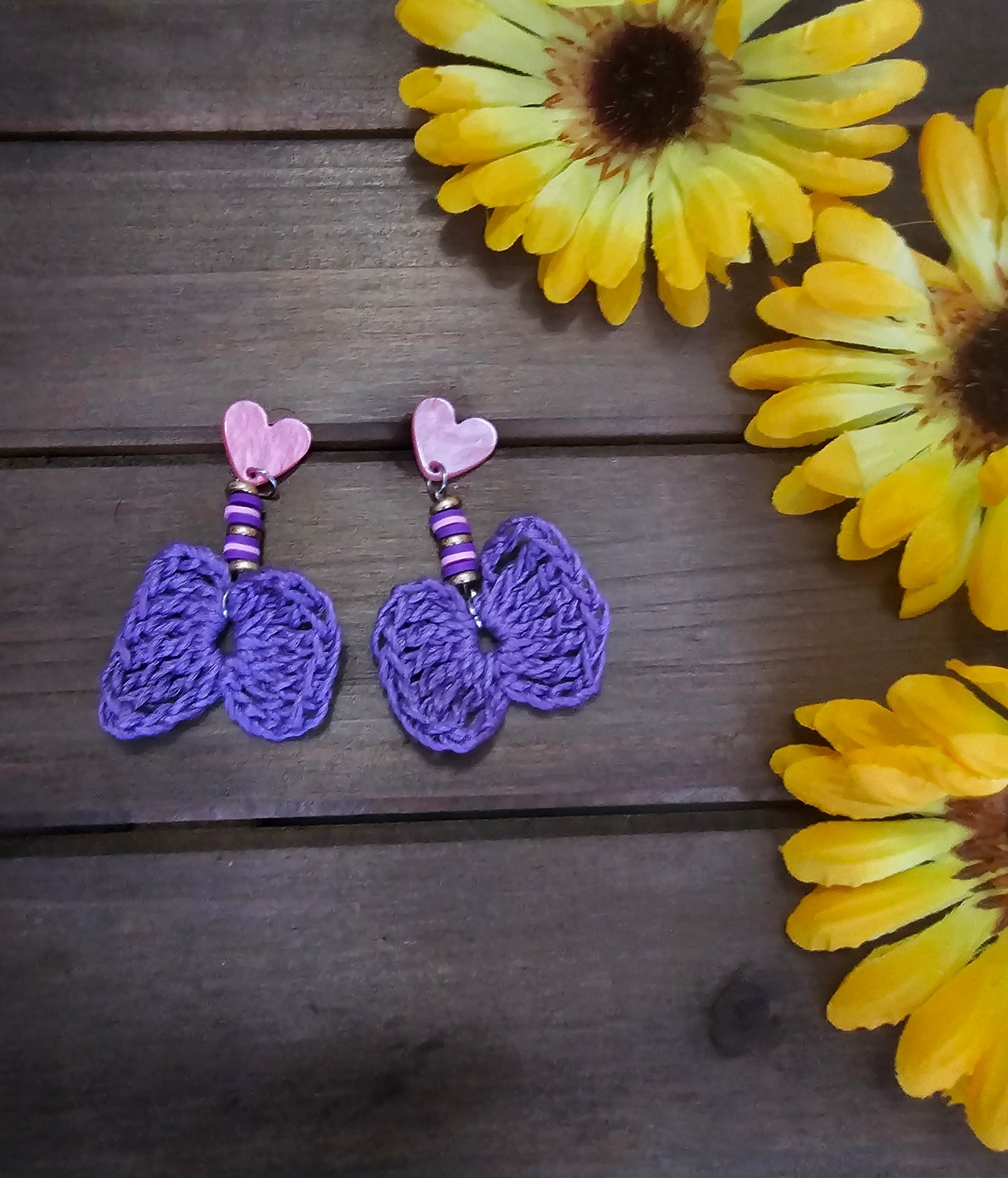 beaded bow earrings purple made with green clay beads and heart earring findings  and a bamboo crocheted bow 