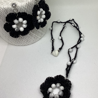 black flower necklace and earring set, made with white howlite beads, flower necklace has a magnetic heart clasp, earring have a rhinestone stud