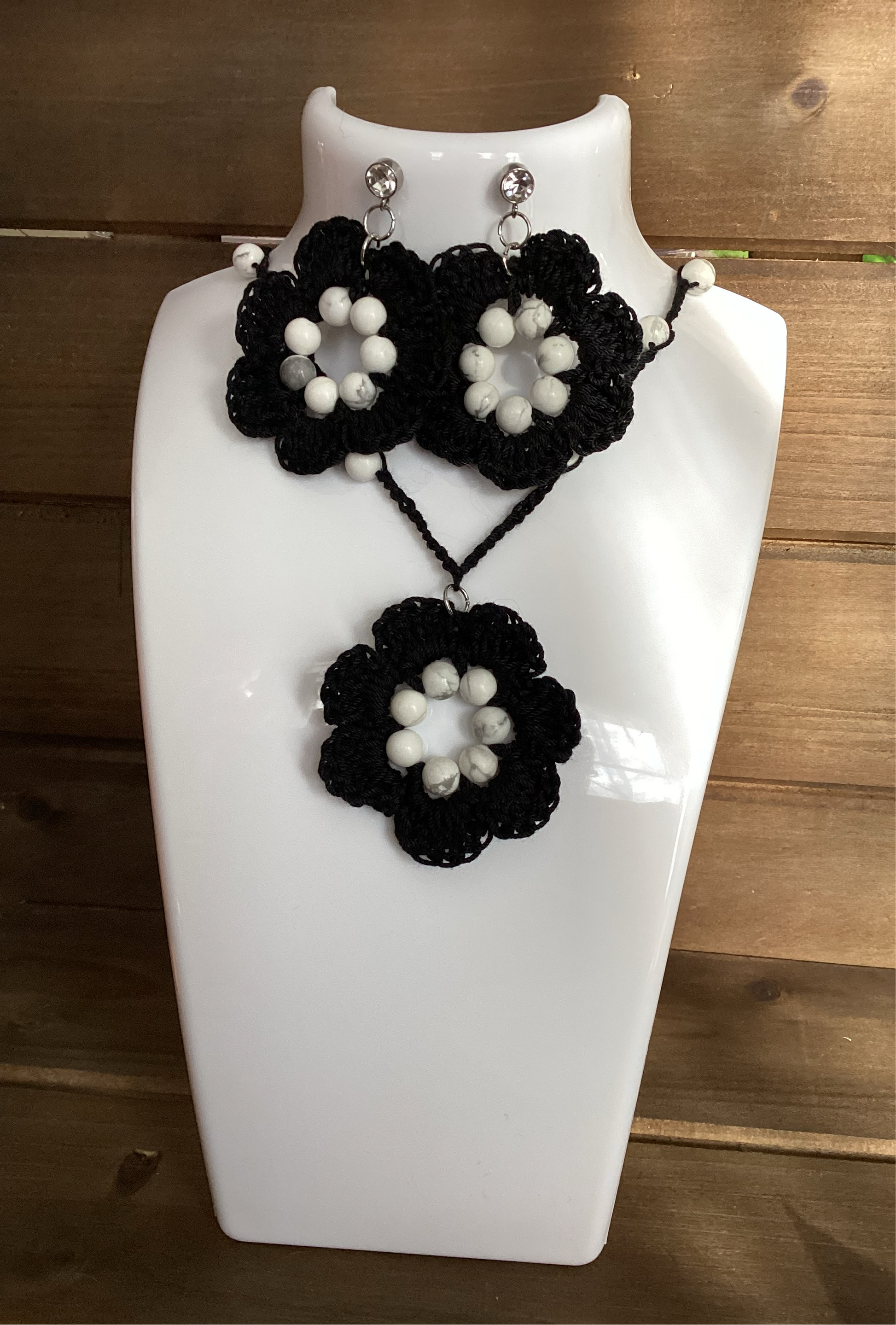 black flower necklace and earring set, made with white howlite beads, flower necklace has a magnetic heart clasp, earring have a rhinestone stud