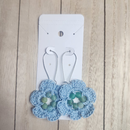 floral earrings  blue on and earring card 